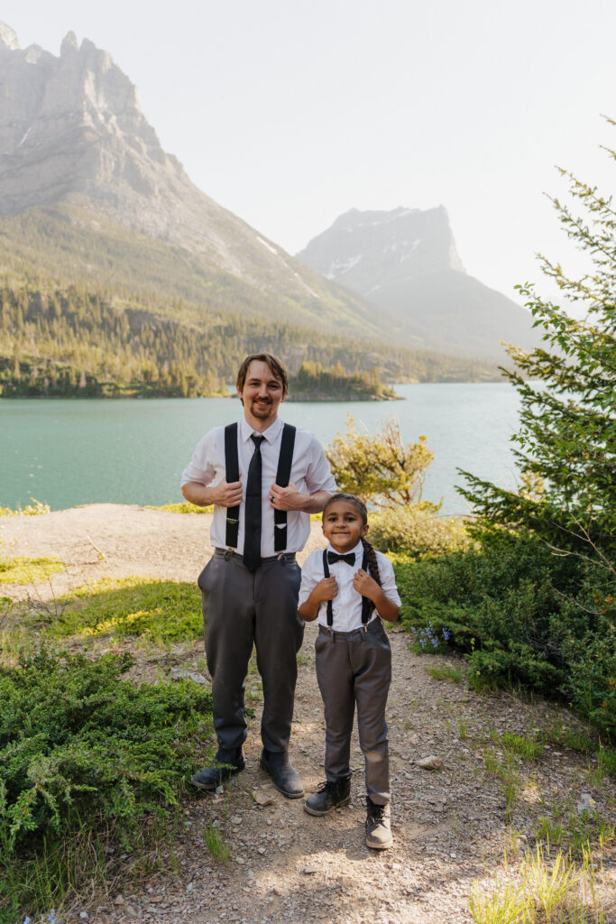Will and Aiden pose by holding their suspenders in the shade at Sun Point.