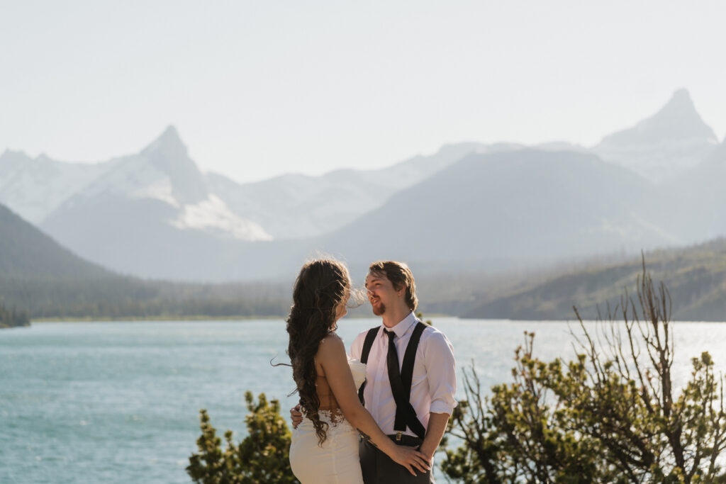 Bride and groom share quiet vows while holding each other at Sun Point.