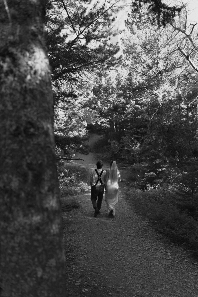 Bree, Will, and Aiden walking to the rock at Sun Point in Glacier National Park.