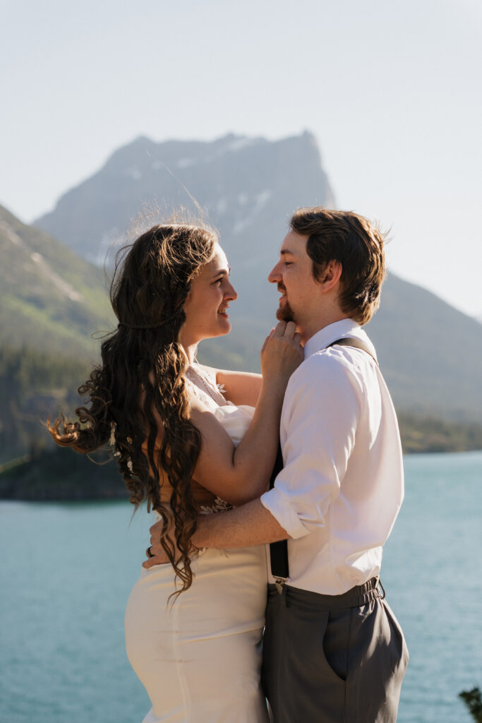 Bride and groom hug after eloping in Sun Point Glacier National Park.