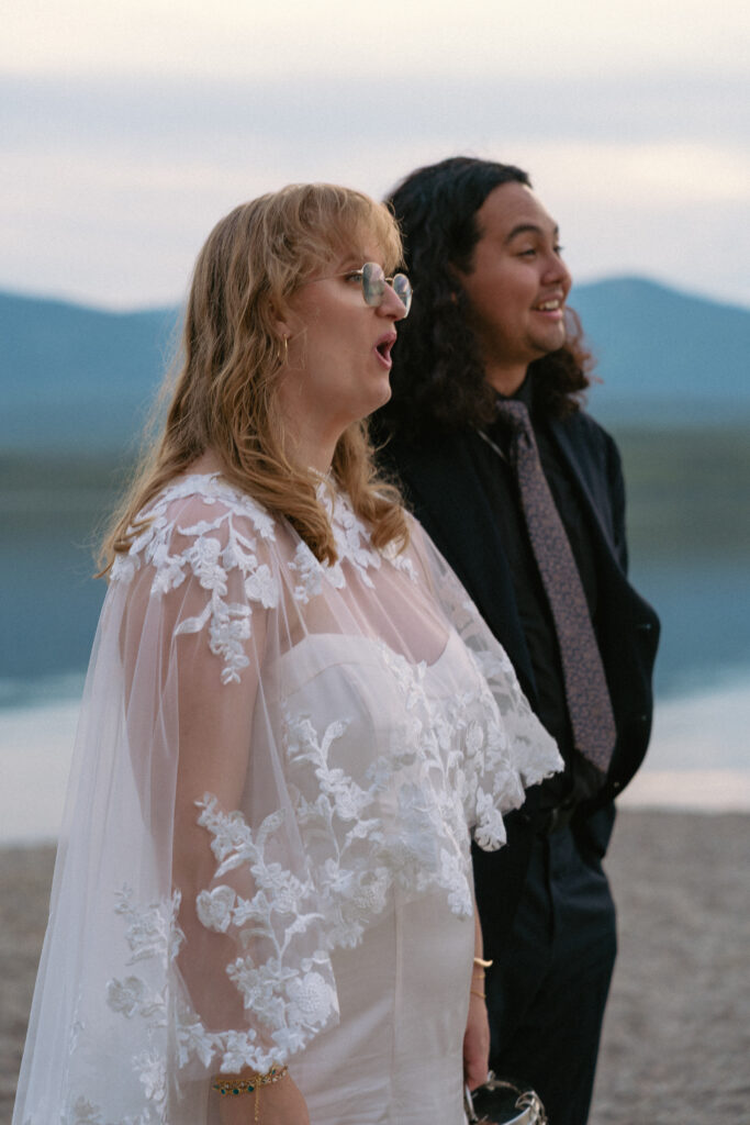 Bride and groom awestruck with the beauty of Glacier National Park.