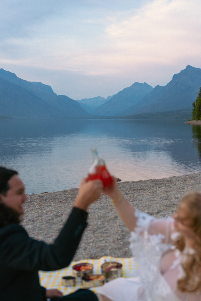 Couple cheers over Lake McDonald.